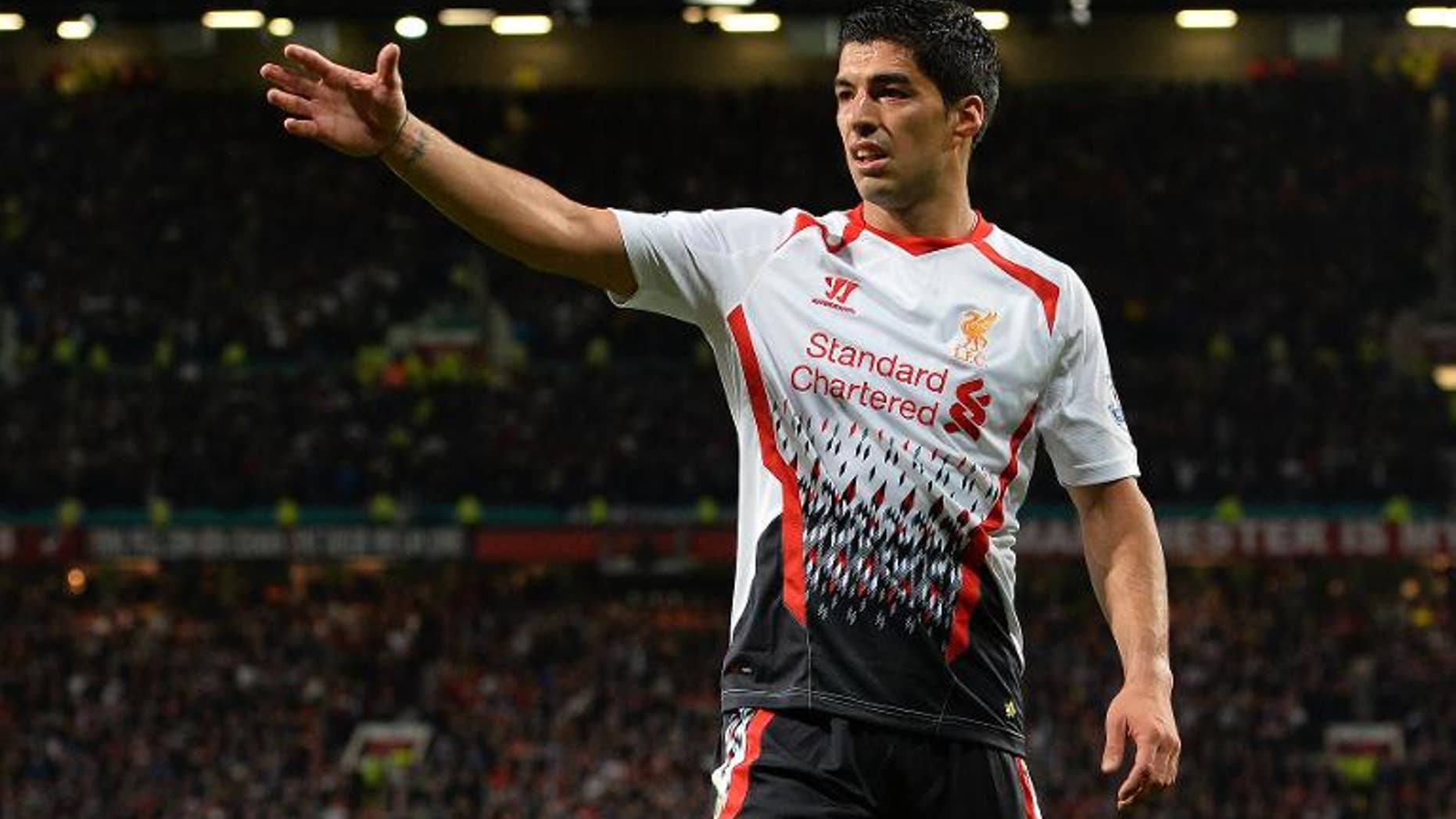 Liverpool's Uruguayan forward Luis Suarez reacts during the League Cup football match between Manchester United and Liverpool at Old Trafford in Manchester on September 25, 2013. Manchester United won 1-0.