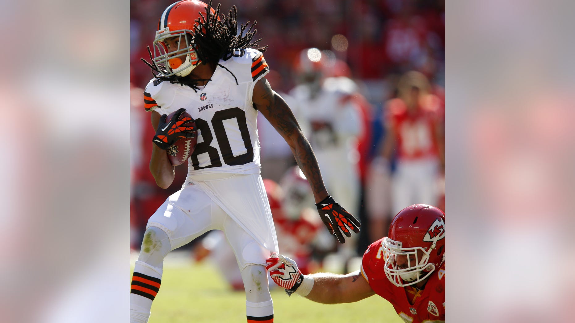Cleveland Browns wide receiver Travis Benjamin (80) breaks away from Kansas City Chiefs free safety Bradley McDougald (48) during the second half of an NFL football game in Kansas City, Mo., Sunday, Oct. 27, 2013. (AP Photo/Ed Zurga)