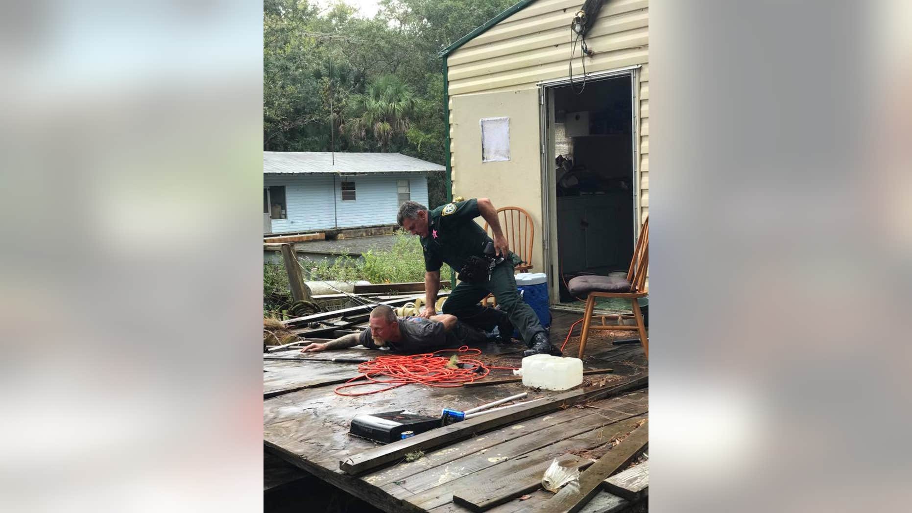 Kevin Wyatt, wanted on five warrants including sex trafficking, was captured by police after being discovered hiding on a houseboat.