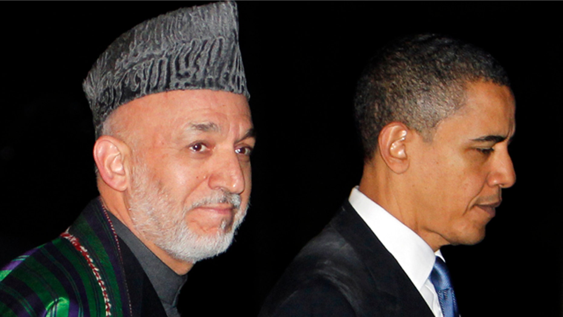 March 28: President Obama walks with Afghan President Hamid Karzai at the presidential palace in Kabul, Afghanistan.