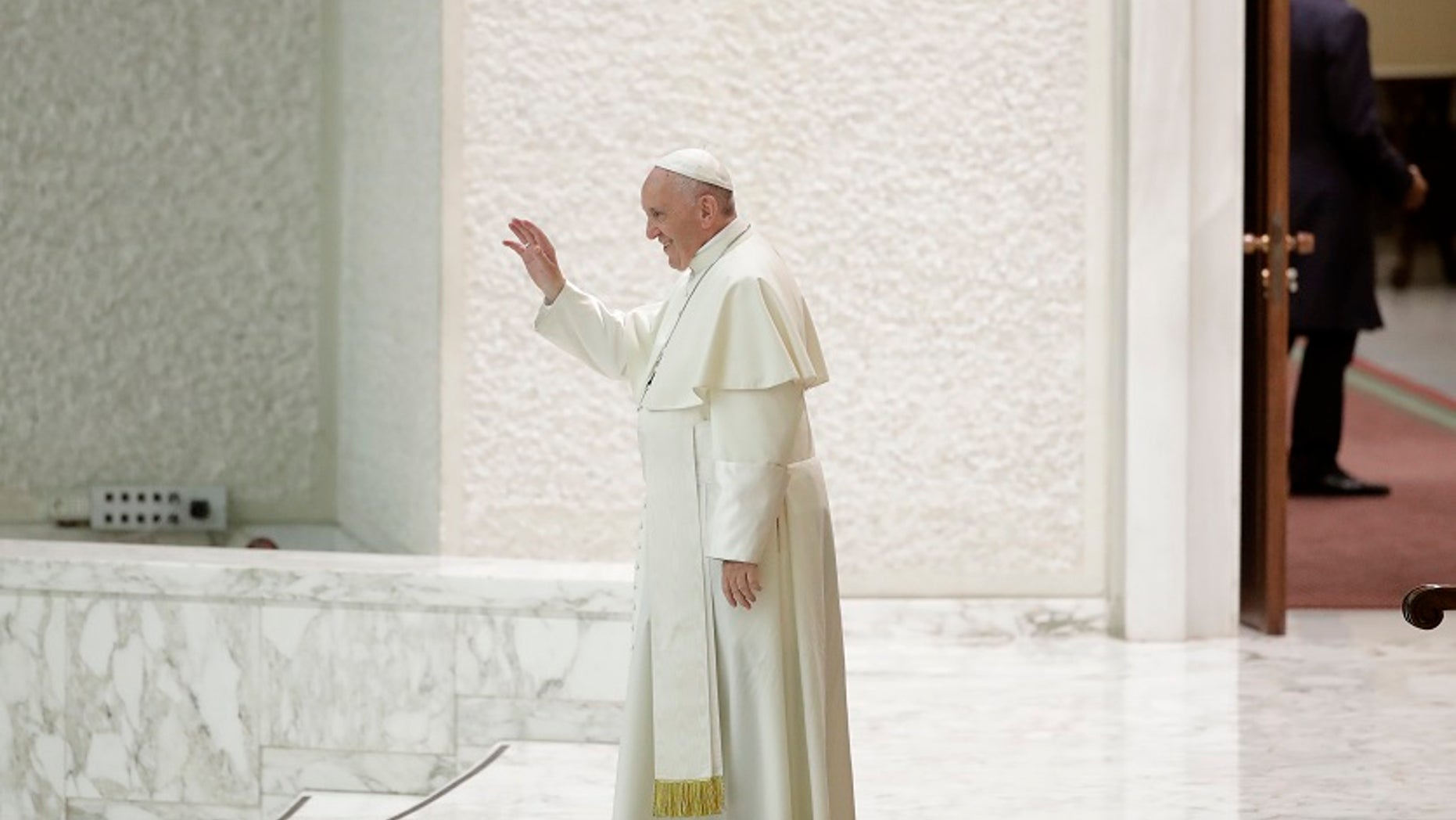 Pope Francis leaves after an audience with an association of people honored by the Italian Presidency for their commitment to their work, in the Paul VI Hall at the Vatican, Friday, June 15, 2018. (AP Photo/Alessandra Tarantino)