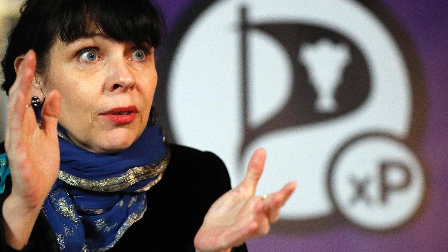Birgitta Jonsdottir of the Pirater (Pirate) Party addresses the media during a conference in Reykjavik, Iceland, Sunday, Oct. 30, 2016. No party emerged Sunday with a clear mandate to form a government from Saturday's election, with the Pirate Party placed third, behind the Independence Party and the Left-Green movement. (AP Photo/Frank Augstein)