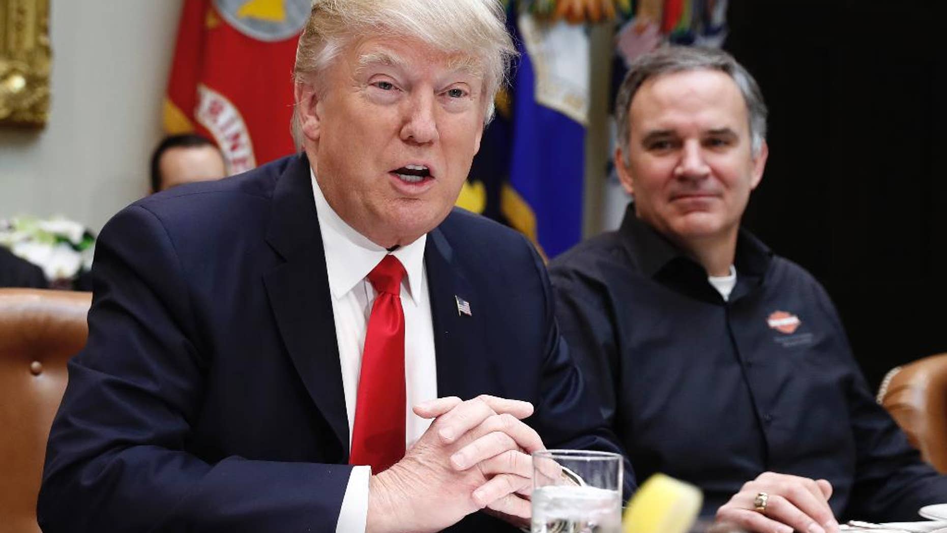 President Donald Trump, joined by Harley Davidson President and CEO Matt Levatich, talks to media before a lunch meeting with Harley Davidson executives and union representatives in the Roosevelt Room of the White House in Washington, Thursday, Feb. 2, 2017. (AP Photo/Carolyn Kaster)
