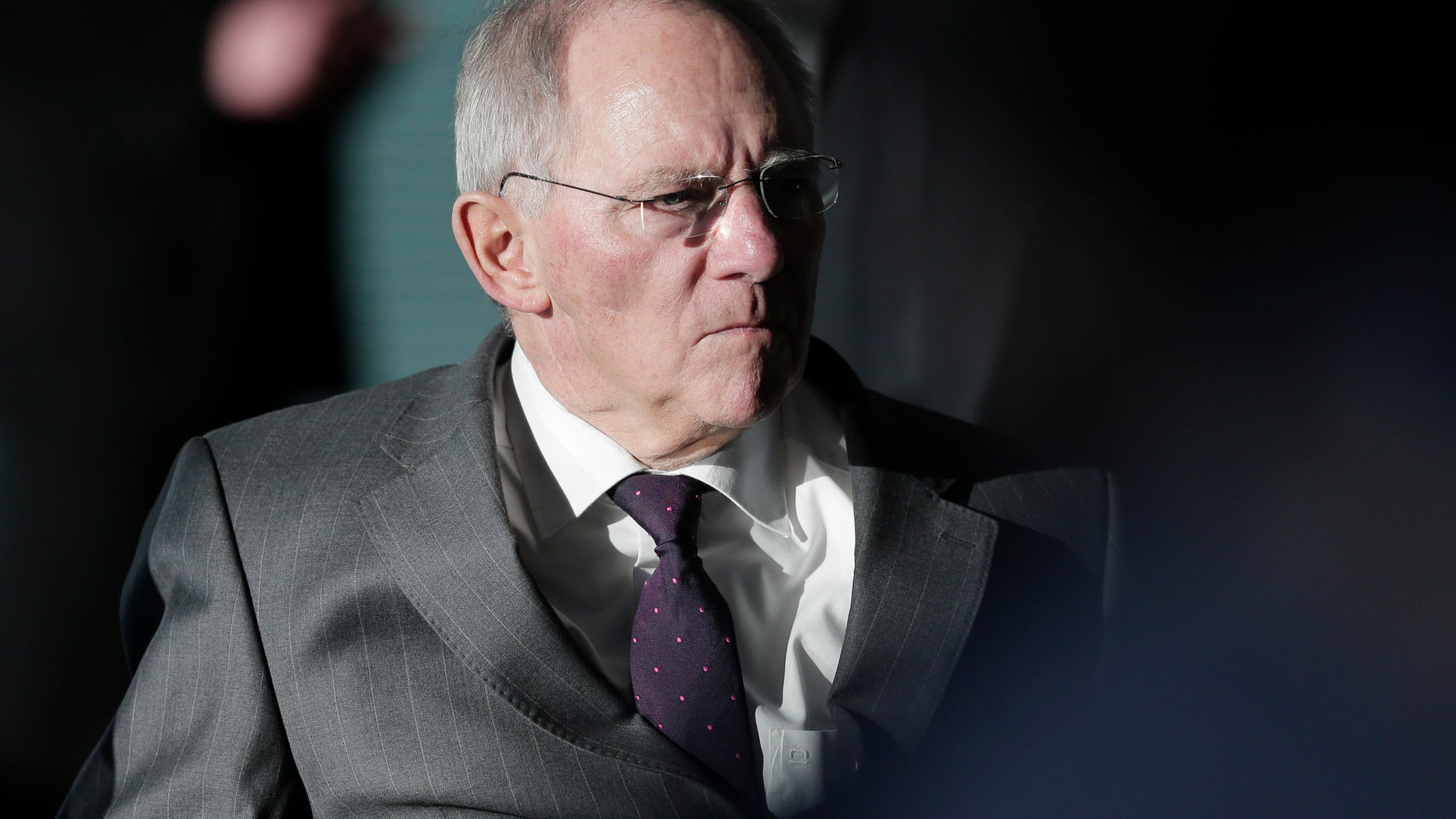 German Finance Minister Wolfgang Schaeuble arrives for the weekly cabinet meeting at the chancellery in Berlin, Germany, Wednesday, Feb. 6, 2013. The cabinet will discuss a new national law for bank regulations. (AP Photo/Markus Schreiber)