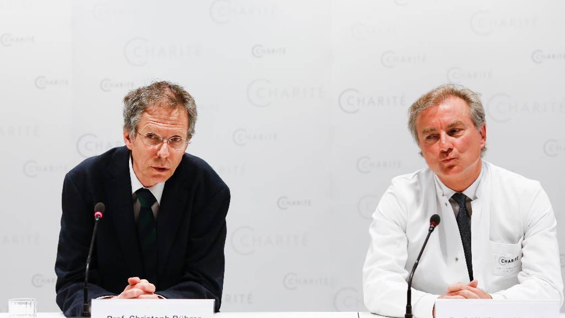 FILE - In this May 27, 2015 file photo Christoph Buehrer, left, director of neonatology at Charite Hospital and Wolfgang Henrich, director of gynecology at Charite Hospital, brief the media about the situation of 65-year old mother Annegret Raunigk and her quadruplets, in Berlin, Germany. Doctors said Wednesday, June 17, 2015 quadruplets born prematurely a month ago to a 65-year-old woman in Germany are doing well and gaining weight but one remains on a respirator. (AP Photo/Markus Schreiber, file)