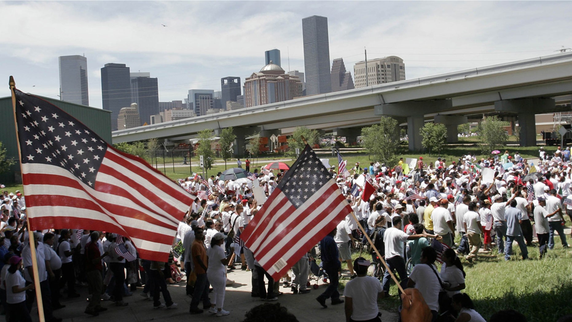 HOUSTON - APRIL 10: Thousands of people march towards downtown in an immigration reform protest April 10, 2006 in Houston, Texas. Thousands of people joined the march that was organized as part of the nation wide National Day of Action for Immigration Justice Rally calling on U.S. Congress to stop the H.R. 4437 bill and create more comprehensive immigration reform. The House bill, which criminalizes undocumented immigrants and the people who help them, has triggered large scale protests and rallies across the country. (Photo by Dave Einsel/Getty Images)