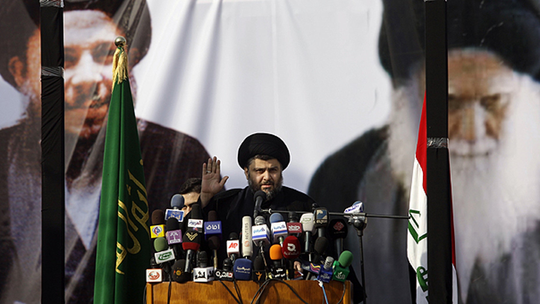 Jan. 8: Shiite cleric Muqtada al-Sadr gestures during his first public appearance since returning from nearly four years of self-imposed exile in Najaf, south of Baghdad, Iraq.