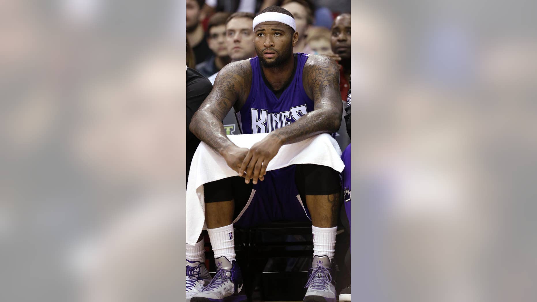 Sacramento Kings' DeMarcus Cousins sits on the bench in the final seconds in the second half of an NBA basketball game against the Houston Rockets Wednesday, Nov. 26, 2014, in Houston. The Rockets won 102-89. (AP Photo/Pat Sullivan)