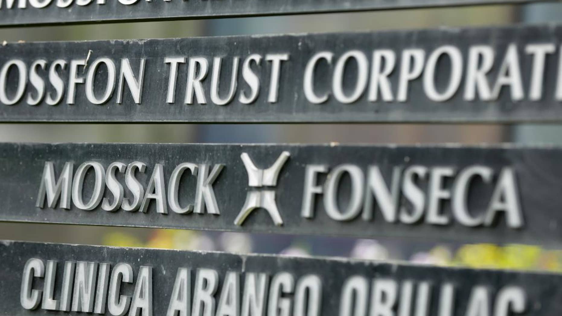 FILE - In this April 4, 2016 file photo, a marquee of the Arango Orillac Building lists the Mossack-Fonseca law firm, in Panama City. Prosecutors in Panama said on Saturday, Feb. 11, 2017 they’ve formally arrested the two partners of the Mossack-Fonseca law firm involved in last year’s "Panama Papers" scandal, in which thousands of pages of documents related to offshore accounts were leaked. The arrests are for money laundering related to another scandal involving bribes paid by the Brazilian company Odebrecht. (AP Photo/Arnulfo Franco, File)