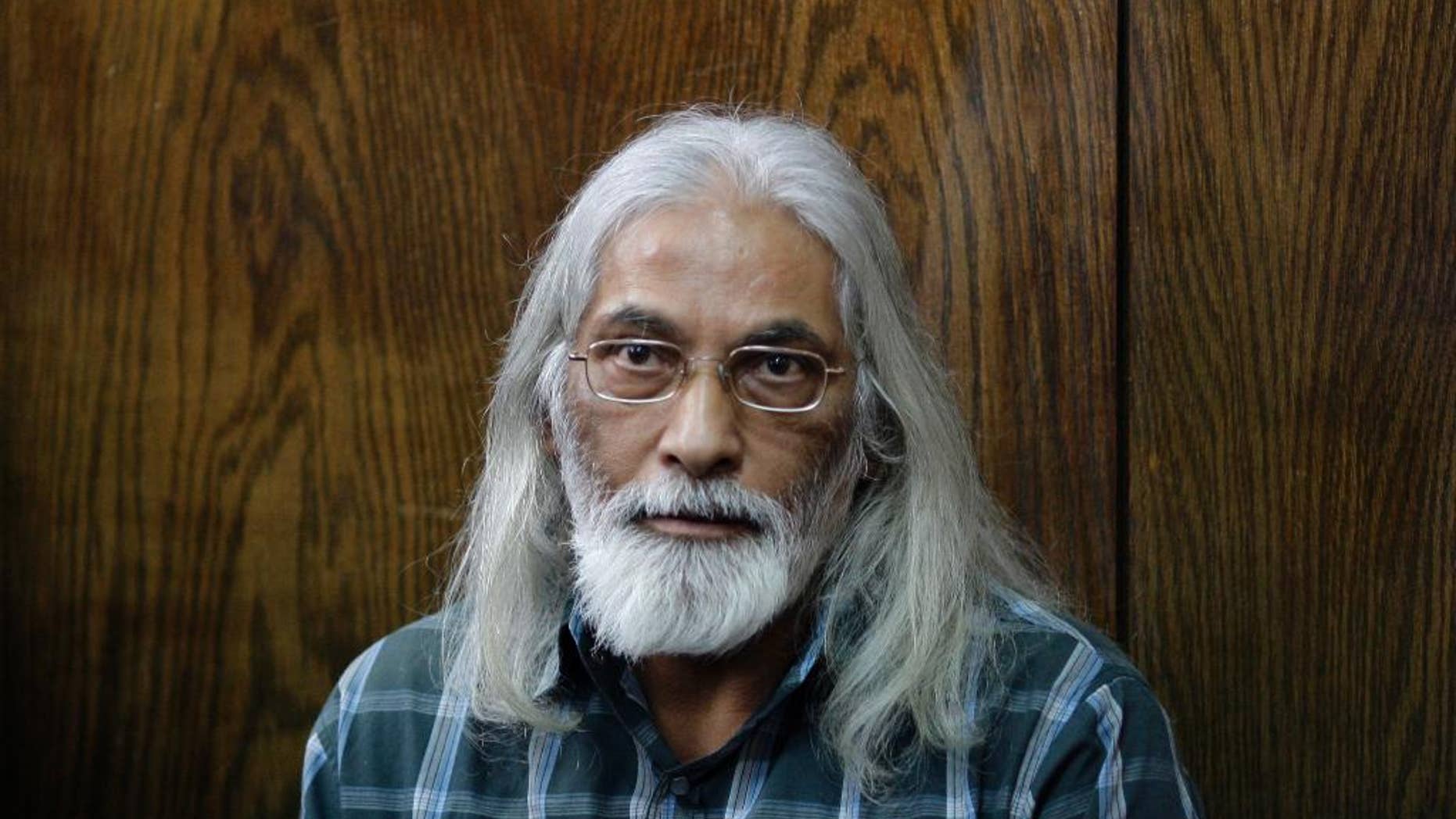 FILE- In this Feb. 14, 2010 file photo, Israeli, Goel Ratzon sits in a courtroom at the district court in Tel Aviv, Israel. An Israeli court on Tuesday, Oct. 28, 2014, sentenced Ratzon, a convicted polygamist and cult leader, to a 30-year prison sentence. Ratzon was found guilty of rape, incest and other offenses in September, but acquitted of enslavement charges. (AP Photo/Ariel Schalit, File)
