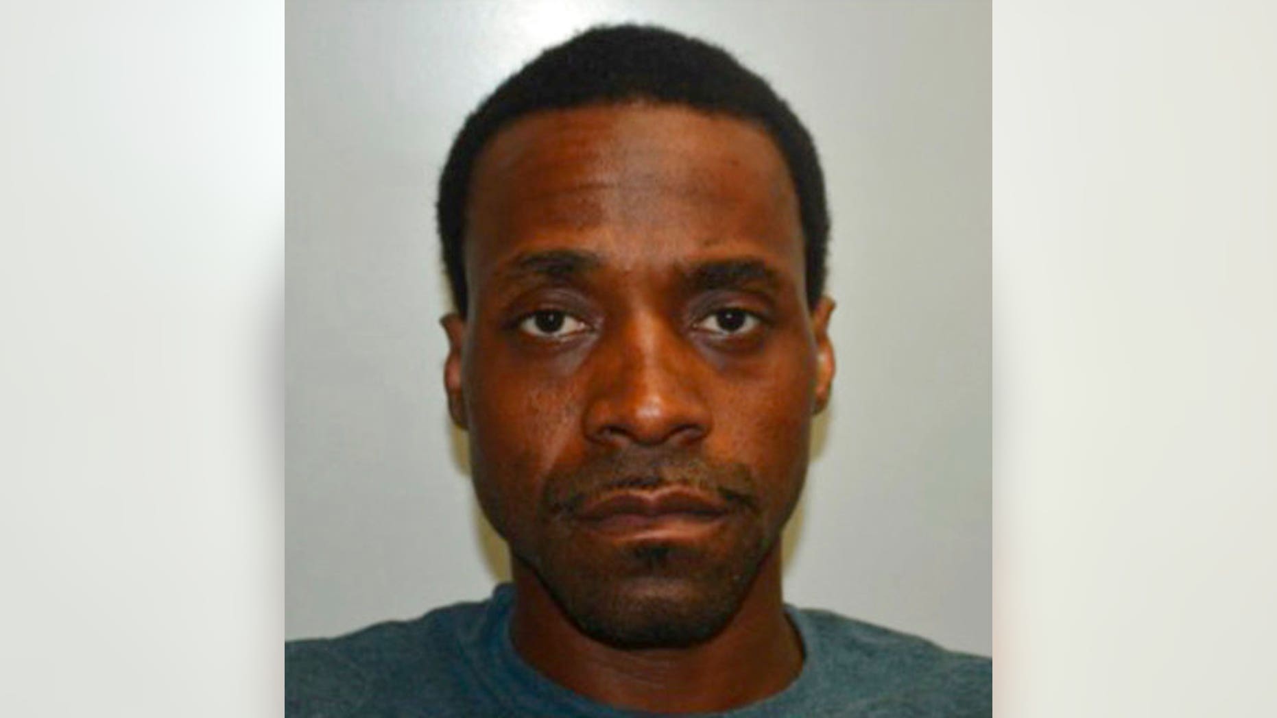 This undated photo provided by the Fresno Police Department shows Kori Ali Muhammad a suspect in the Fresno, Calif., shooting on Tuesday, April 18, 2017. Muhammad was arrested on Tuesday shortly after the deadly morning rampage that left several dead according to police. (Fresno Police Department via AP)