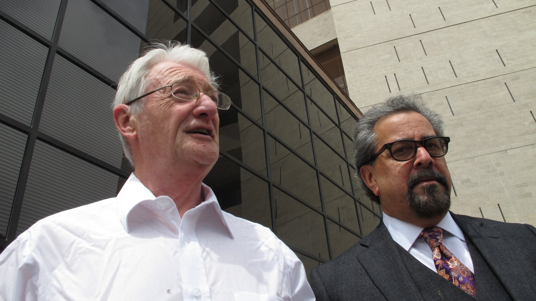 FILE - In this April 25, 2012 file photo, British businessman Christopher Tappin, left, leaves federal court with one of his lawyers, Kent Schaffer, in El Paso, Texas. A U.S. judge on Wednesday, Jan. 9, 2013 is expected to sentence the 65-year-old Tappin, who pleaded guilty in November to trying to buy missile parts and resell them to Iran. (AP Photo/Juan Carlos Llorca, File)