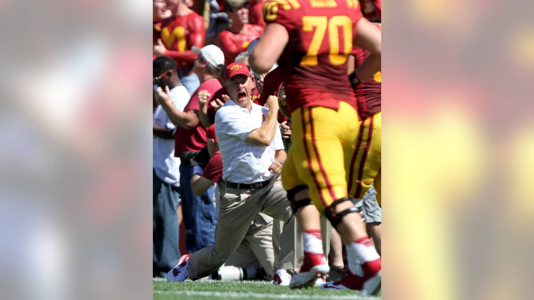 Iowa State head coach Paul Rhoads celebrates after Iowa State wide receiver Jarvis West returned a punt for a touchdown during the first half of an NCAA college football game against Kansas State, Saturday, Sept. 6, 2014, in Ames, Iowa. (AP Photo/Justin Hayworth)