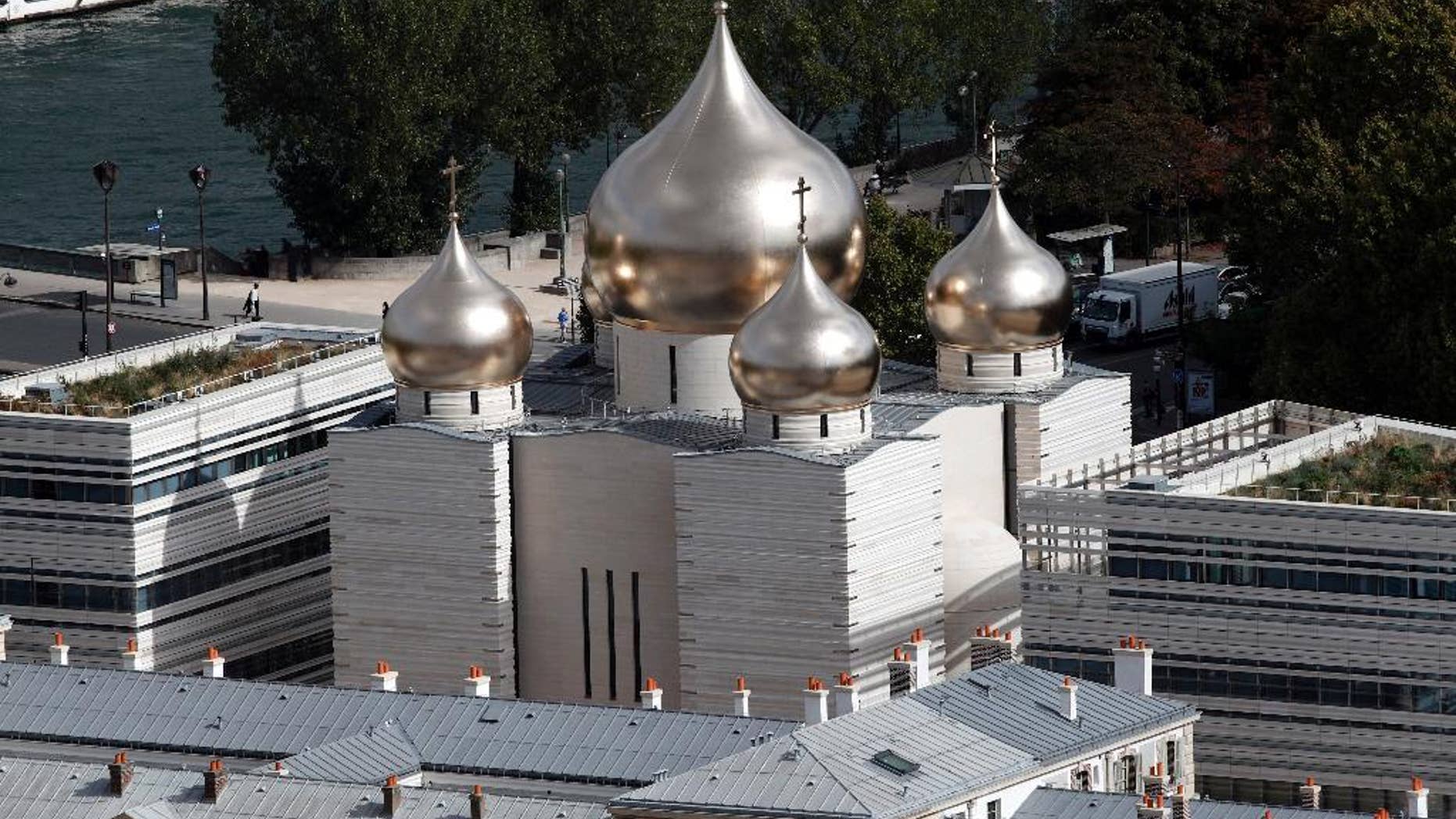This photo taken on Sept.28, 2016 shows the he new Russian Holy Trinity orthodox cathedral in Paris. Russian President Vladimir Putin had planned to attend the inauguration ceremony at the Russian Orthodox Spiritual and Cultural Center Wednesday Oct. 19, 2016 in the heart of the French capital but postponed his visit to Paris following a spat with French leader Francois Hollande over the war in Syria. (AP Photo/Christophe Ena)