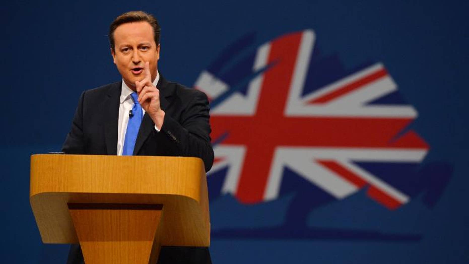 British Prime Minister David Cameron addresses delegates at the annual Conservative Party Conference in Manchester, north-west England, on October 2, 2013