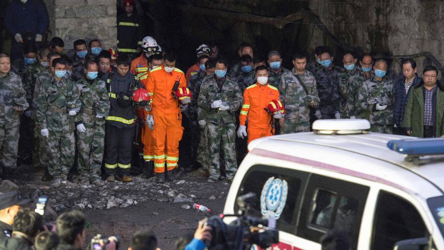 Rescuers mourn for victims at Jinshangou Coal Mine in Chongqing, southwest China, on Tuesday.