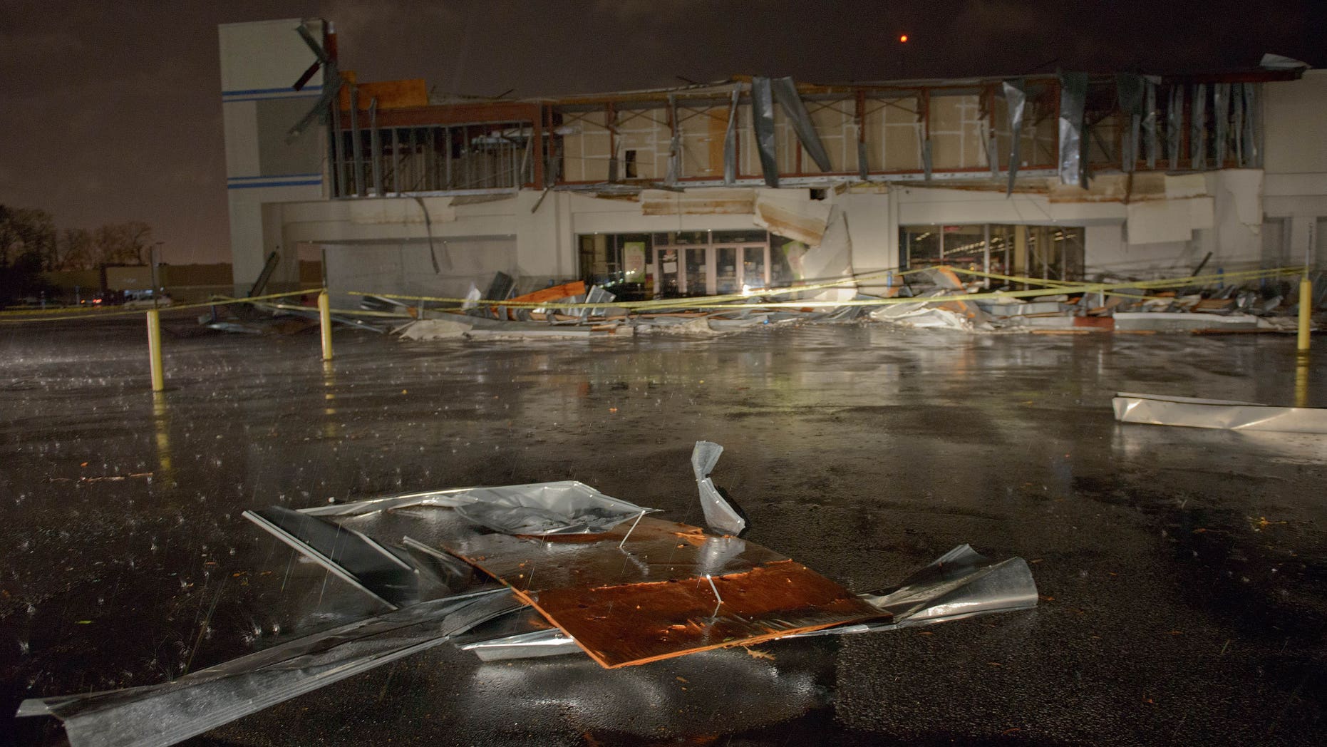 The Books-A-Million store is seen damaged by heavy wind and rain during a major storm in Monroe, La., Saturday, Dec. 21, 2013. (AP Photo/Matthew Hinton)