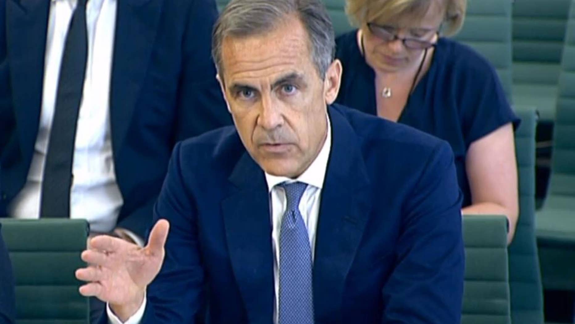 In this image taken from video, Bank of England's governor Mark Carney answers questions in front of the Commons Treasury Select Committee in the Houses of Parliament, central London, Wednesday Sept. 7, 2016. (PA via AP)