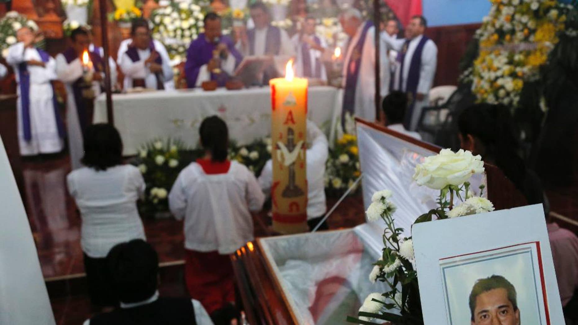 This Sept. 21, 2016 photo shows the funeral Mass for slain Rev. Jose Alfredo Suarez de la Cruz at Our Lady of Asuncion Church in Paso Blanco, Veracruz state, Mexico, his hometown. Church leaders are increasingly frustrated by authorities’ inability to protect their priests under Mexican President Enrique Pena Nieto’s administration. (AP Photo/Marco Ugarte)
