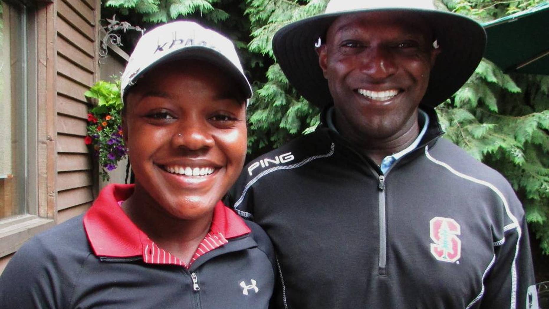 Mariah Stackhouse, left, and her father, Ken, poses for a photo at Columbia Edgewater Country Club in Portland, Ore., Wednesday, June 29, 2016. Stackhouse, a recent Stanford graduate, is making her debut as a professional this week at the LPGA Portland Classic. (AP Photo/Anne M. Peterson)