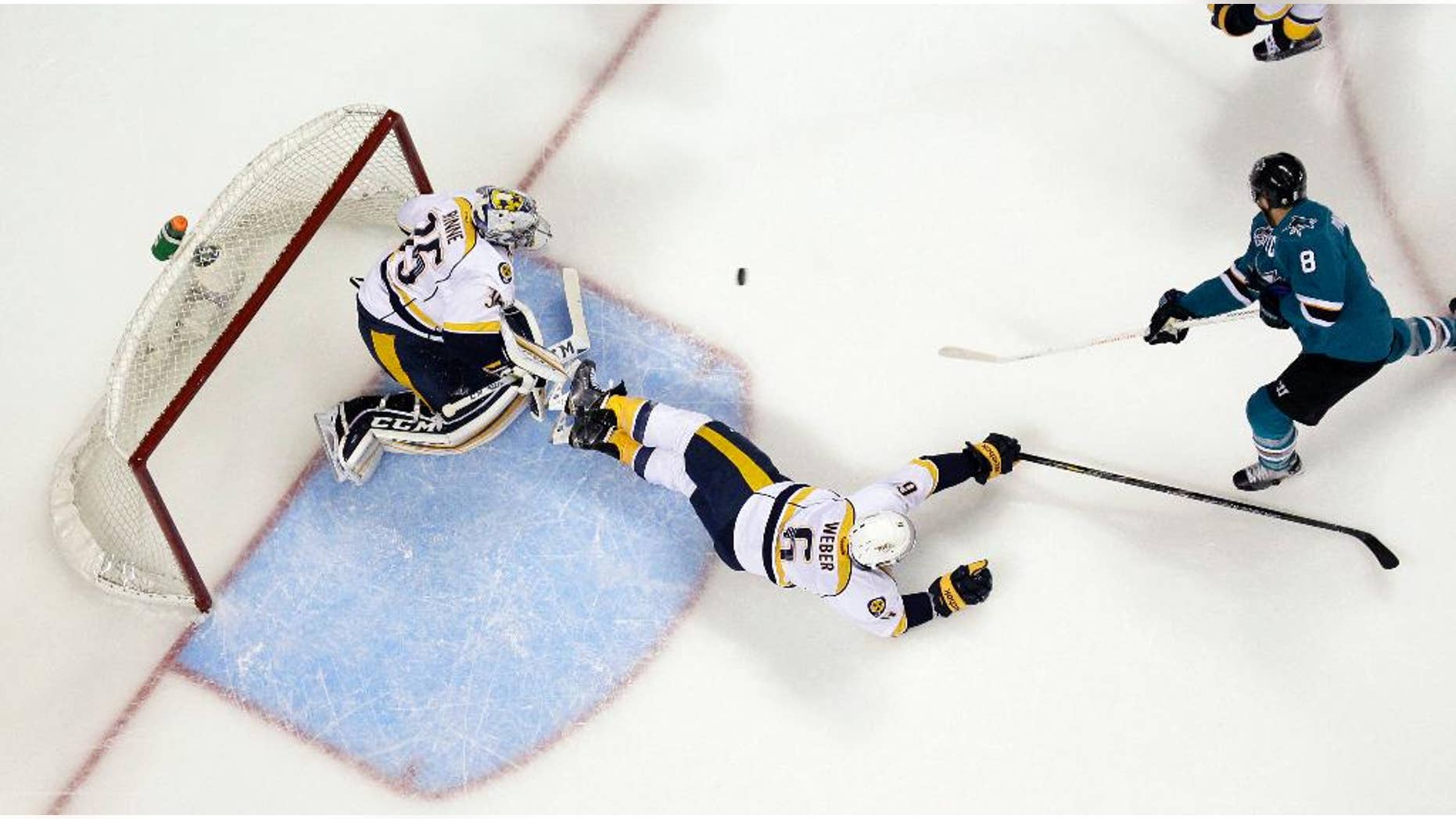May 12, 2016: San Jose Sharks forward Joe Pavelski (8) scores past Nashville Predators defenseman Shea Weber (6) and goalie Pekka Rinne during the first period of Game 7 in an NHL Western Conference semifinal series in San Jose, Calif.