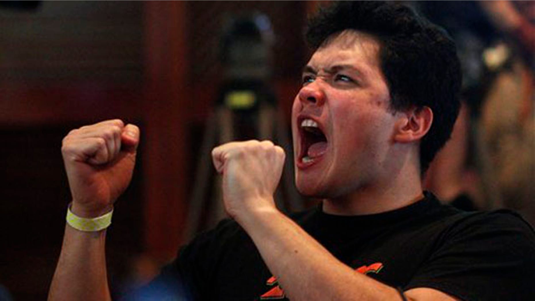 Feb. 16, 2012: A fan of NBA Knicks' Taiwanese-American Jeremy Lin watches him play against the Sacramento Kings at a local sports bar in Taipei, Taiwan.