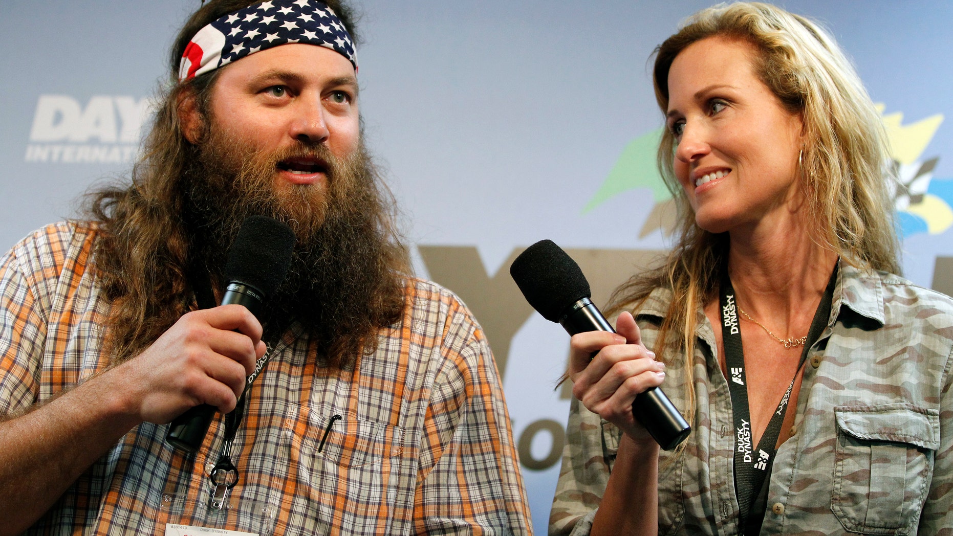 Feb. 24, 2013. Willie Robertson, left, and Korie Robertson, of the reality TV show "Duck Dynasty", before the Daytona 500 NASCAR Sprint Cup Series auto race, at Daytona International Speedway in Daytona Beach, Fla.