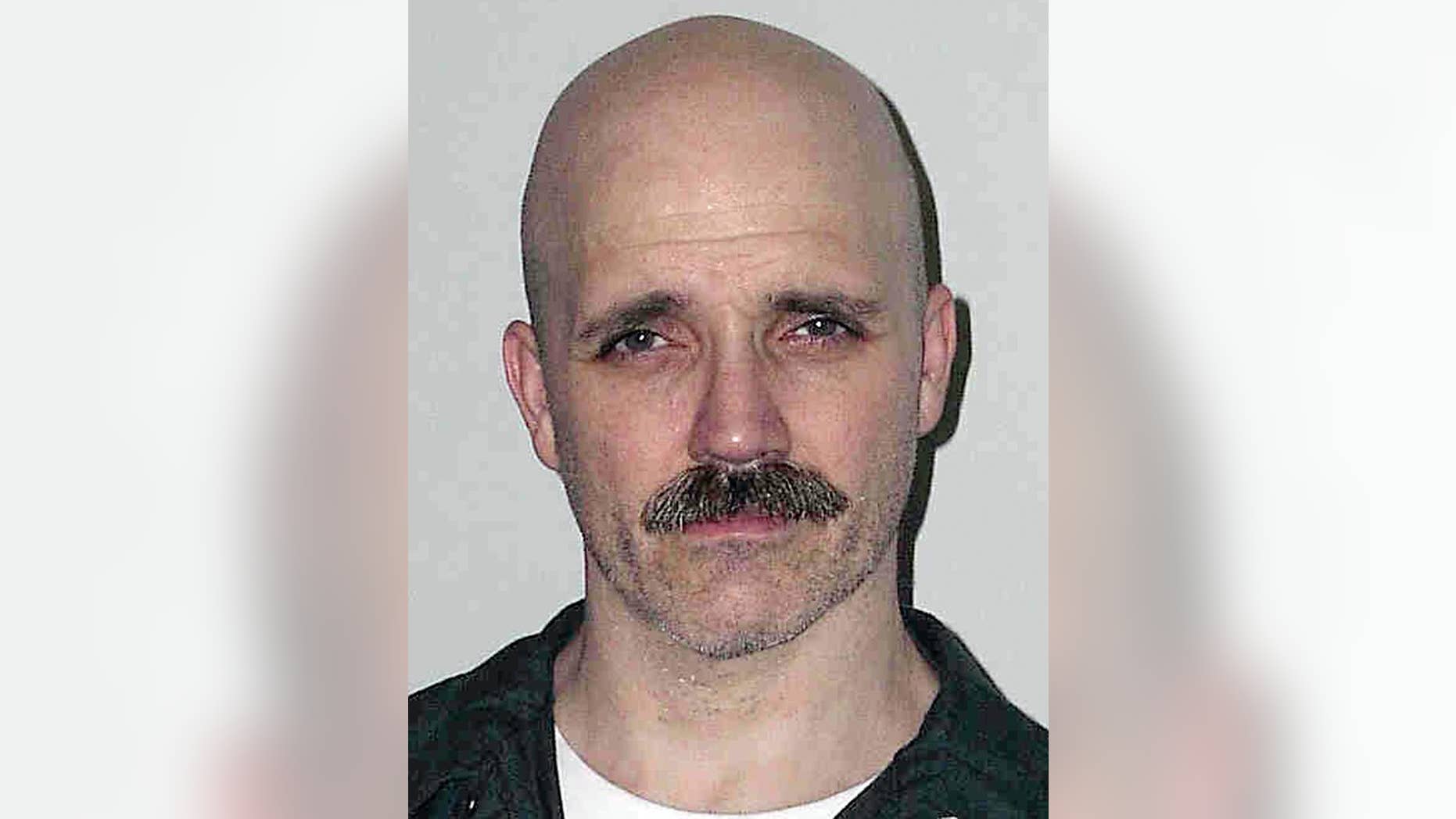 FILE - This 2005, file inmate photo provided by the New Hampshire Department of Corrections shows Cleo Roy, convicted of gunning down a Manchester, N.H., police officer Ralph Miller in 1976. The state granted parole to the Roy on Wednesday, Oct. 5, 2016, after he served 40 years of his 50-year sentence. Roy was 15 when he killed the officer. (New Hampshire Department of Corrections via AP, File)