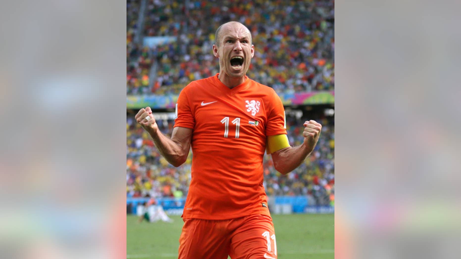 Netherlands' Arjen Robben celebrates after the World Cup round of 16 soccer match between the Netherlands and Mexico at the Arena Castelao in Fortaleza, Brazil, Sunday, June 29, 2014. The Netherlands won the match 2-1. (AP Photo/Wong Maye-E)