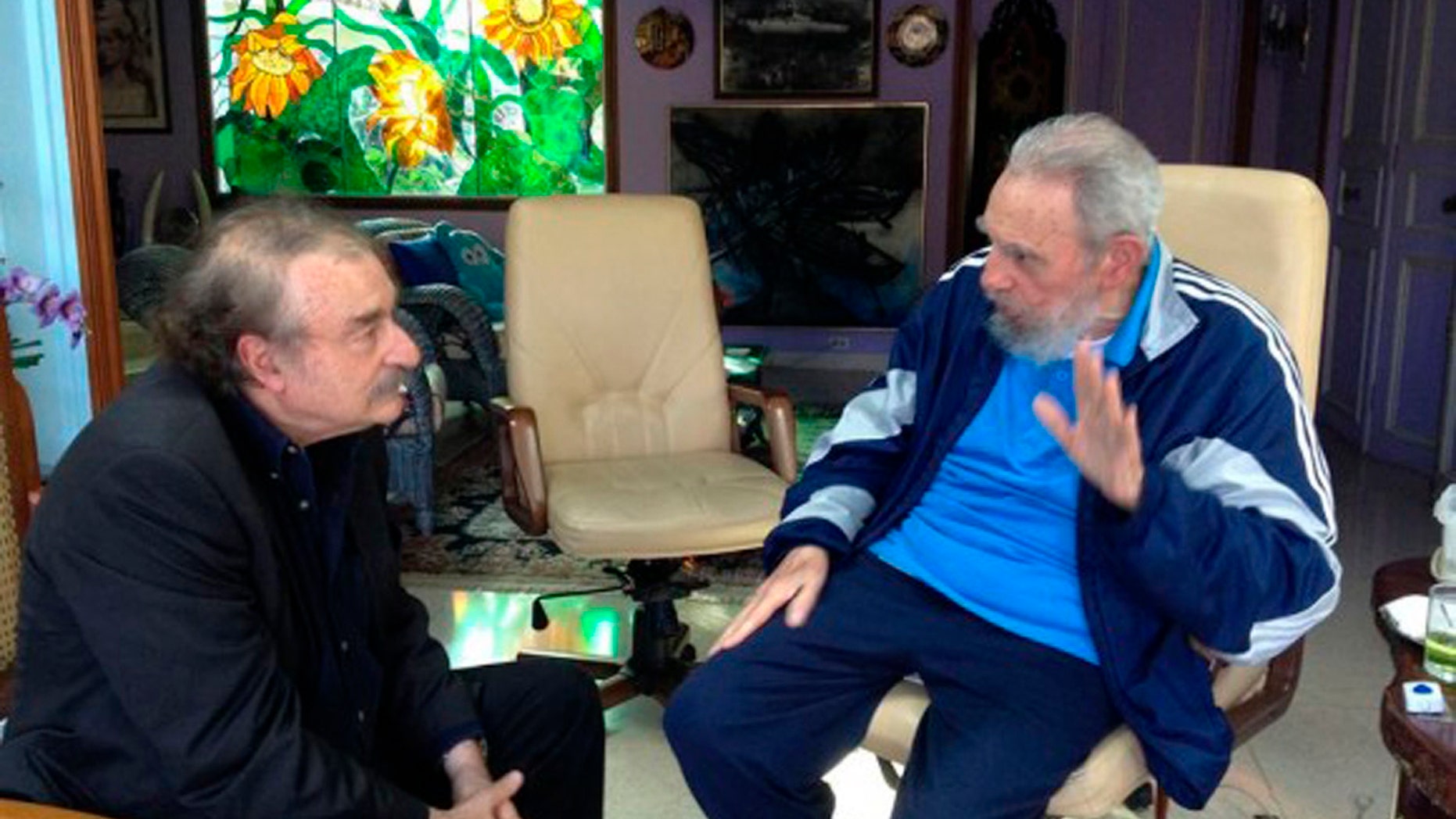In this Friday, Dec. 13, 2013 photo released by the state media Cubadebate website, Cuban leader Fidel Castro, right, talks with Spanish journalist, writer and former editor-in-chief of Le Monde diplomatique, Ignacio Ramonet in Havana, Cuba. (AP Photo/Granma, Estudios Revolucion)