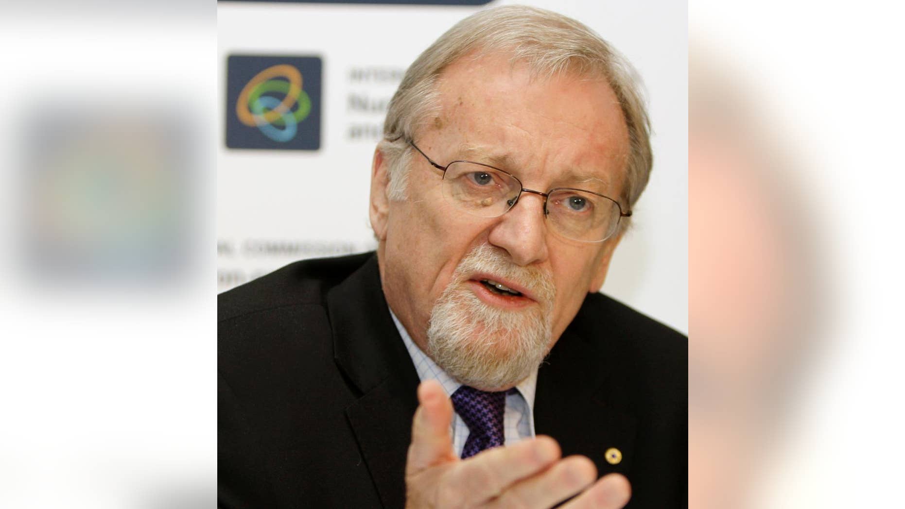 FILE - In this Oct. 21, 2008, file photo, Gareth Evans, former Australian Foreign Minister, speaks to reporters in Sydney. Evans on Thursday, April 13, 2017, called Donald Trump the most "psychologically ill-equipped president" in U.S. history, and called on Australia to distance itself from the United States in favor of forging closer ties with China. (AP Photo/Rick Rycroft, File)