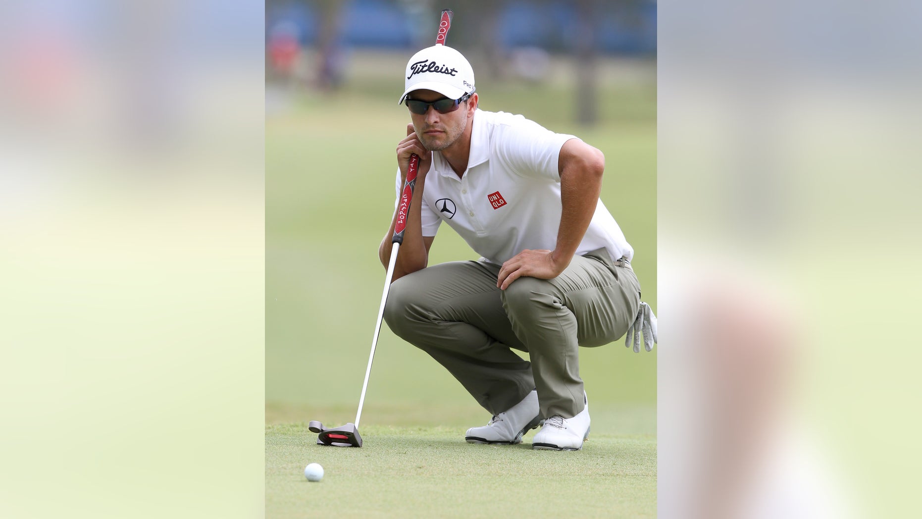 Adam Scott of Australia lines up a putt on the 10th green during the final round of the Australian PGA golf championship held at the Royal Pines Resort, on the Gold Coast, in Australia, Sunday, Nov. 10, 2013. (AP Photo/Tertius Pickard)