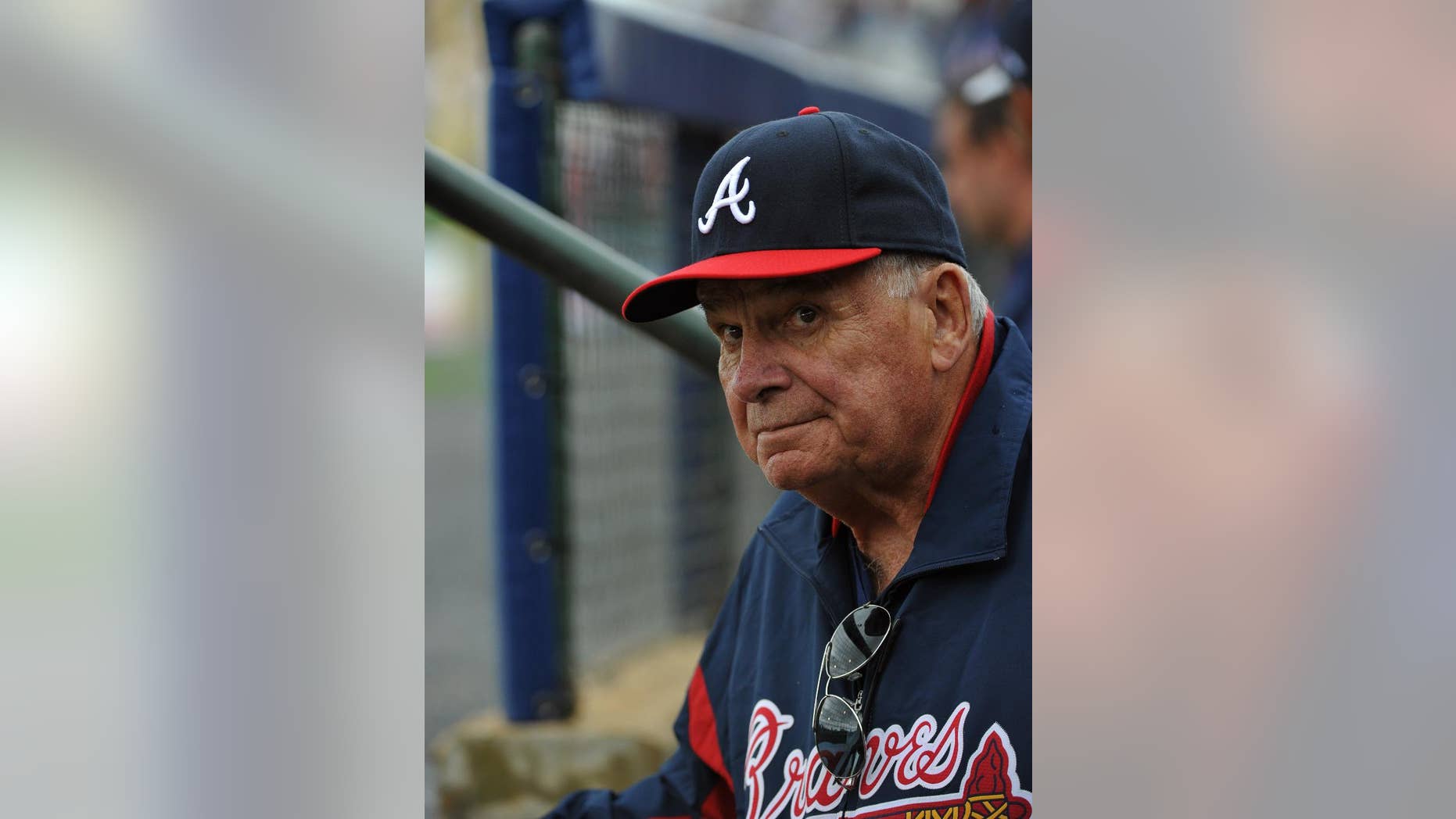 Former Atlanta Braves manager Bobby Cox watches from the dugout as he manages the minor league Future Stars against the Atlanta Braves in an exhibition baseball game Saturday, March 29, 2014, in Rome, Ga. (Associated Press)