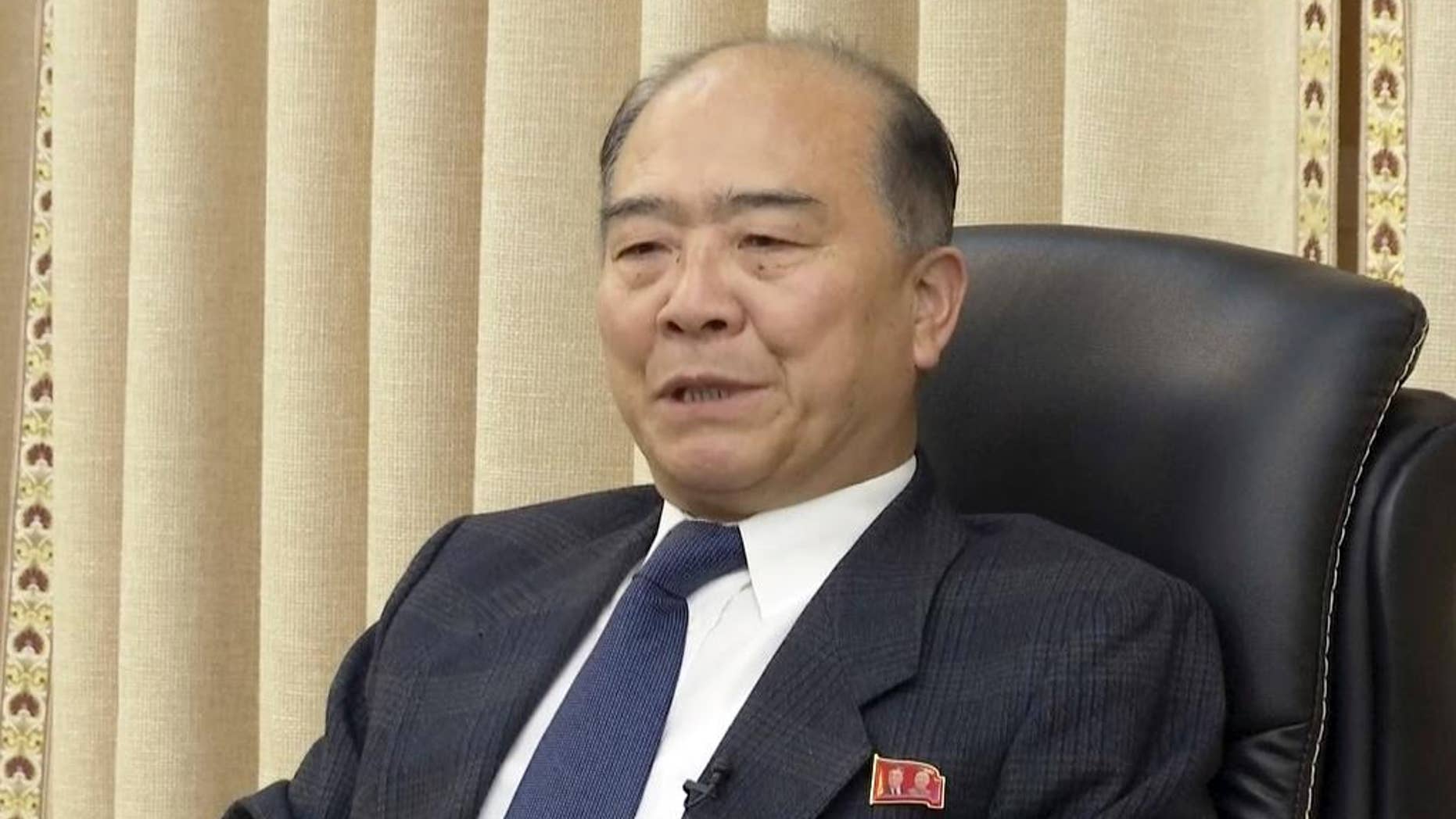 In this photo made from video, Ju Wang Hwan, Senior Researcher, Institute of Disarmament and Peace, North Korean Ministry of Foreign Affairs speaks during a media briefing, Thursday, Dec. 22, 2016, in Pyongyang, North Korea. North Korea's Foreign Ministry on Thursday accused South Korea of committing "political terror" by stepping up efforts to encourage defections by North Koreans overseas, especially diplomats. (AP Photo)