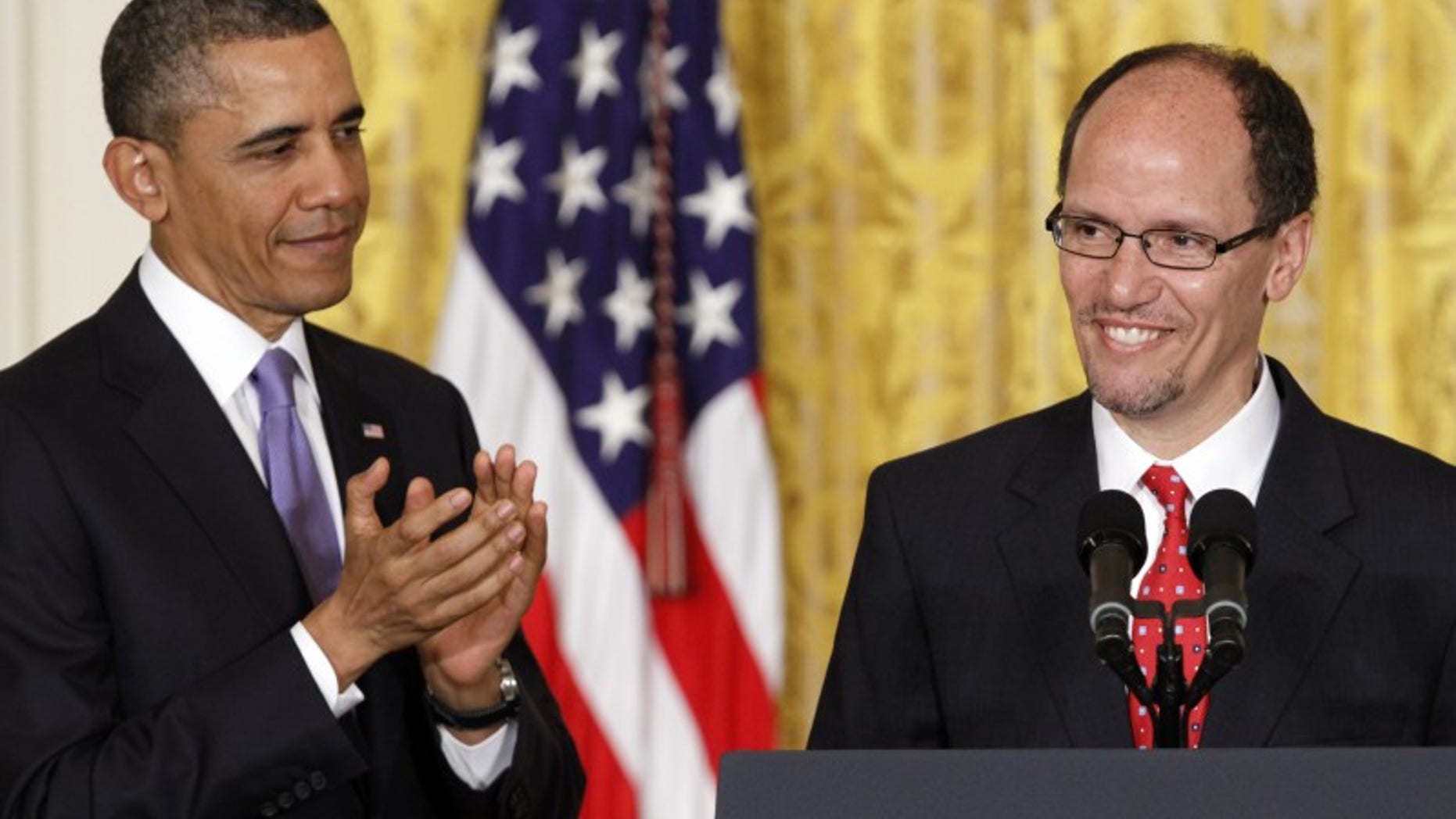 President Barack Obama applauds in the East Room of the White House in Washington, Monday March 18, 2013, where he announced he would nominate Thomas E. Perez, right, for Labor Secretary. (AP Photo/Jacquelyn Martin)