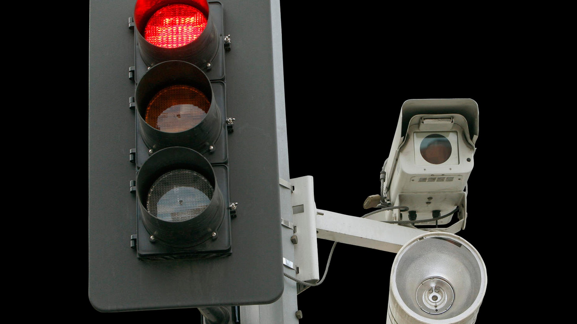A red light camera setup is shown in Los Angeles