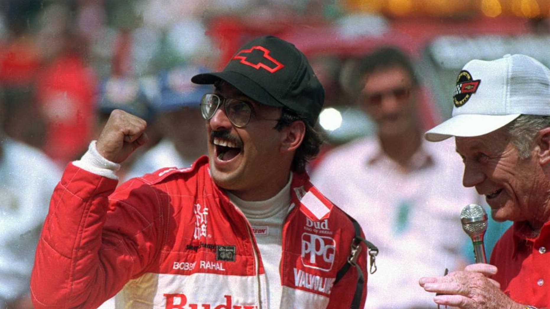 FILE - In this May 31, 1986 file photo, Bobby Rahal reacts after accepting the keys to the Chevrolet Corvette pace car after winning the 70th running of the Indianapolis 500 auto race in Indianapolis, Ind. (AP Photo/File)
