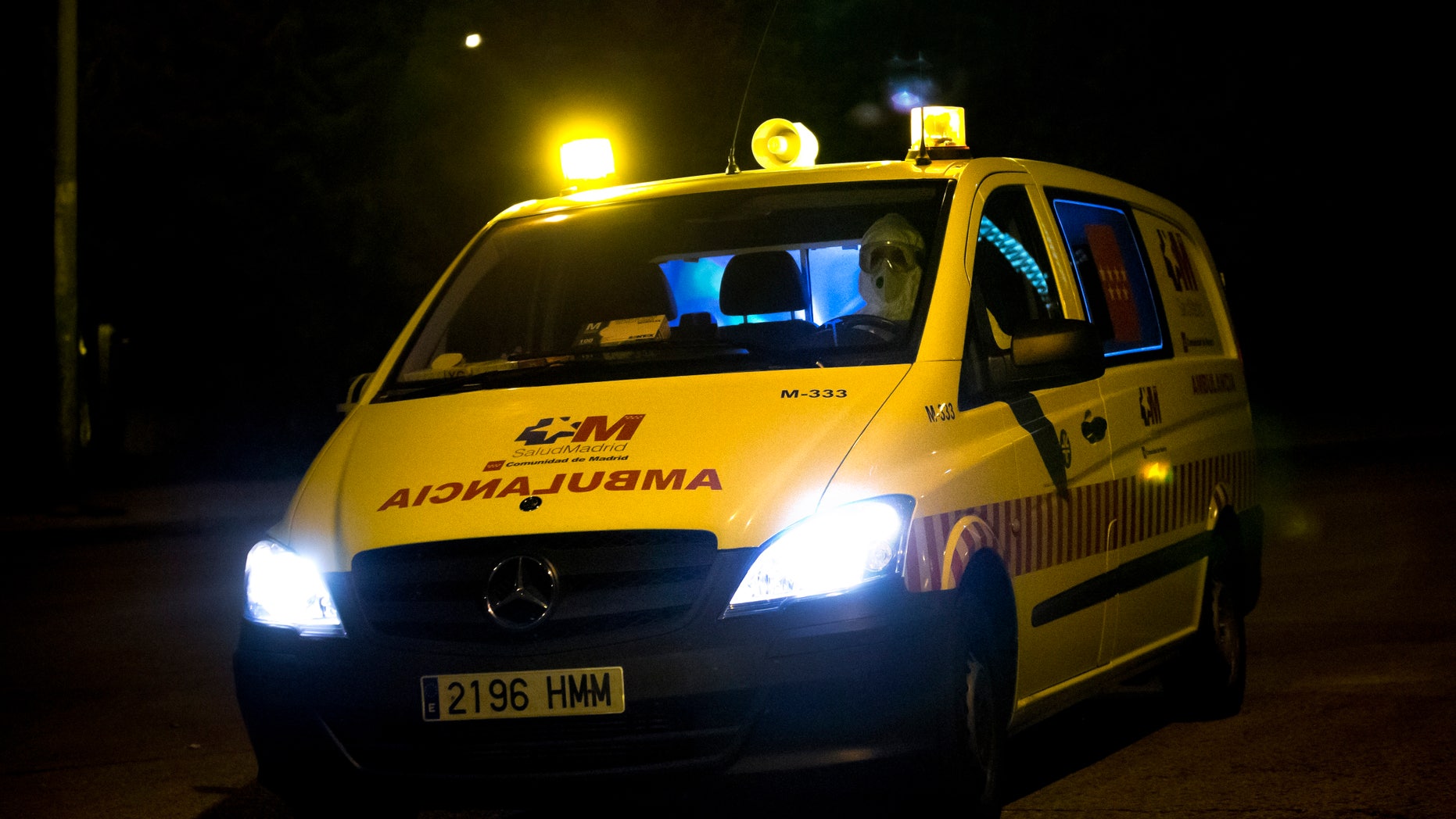 A paramedic in a protective suit drives an ambulance on his arrival at the Carlos III Hospital in Madrid, Spain, Friday, Oct. 17, 2014. A Spanish priest who arrived last week from Liberia have been admitted to a hospital for observation bringing to three the number of admitted on the past 24 hours. An Air France plane was isolated at Madrid's airport on Thursday because of a suspected Ebola case after a passenger was reported to have a fever and shivers, officials said. The passenger, who had traveled from Lagos, Nigeria, was taken by ambulance to an unspecified hospital in Madrid but the rest of the passengers were allowed to leave the plane as normal, Air France said in a statement. (AP Photo/Daniel Ochoa de Olza)