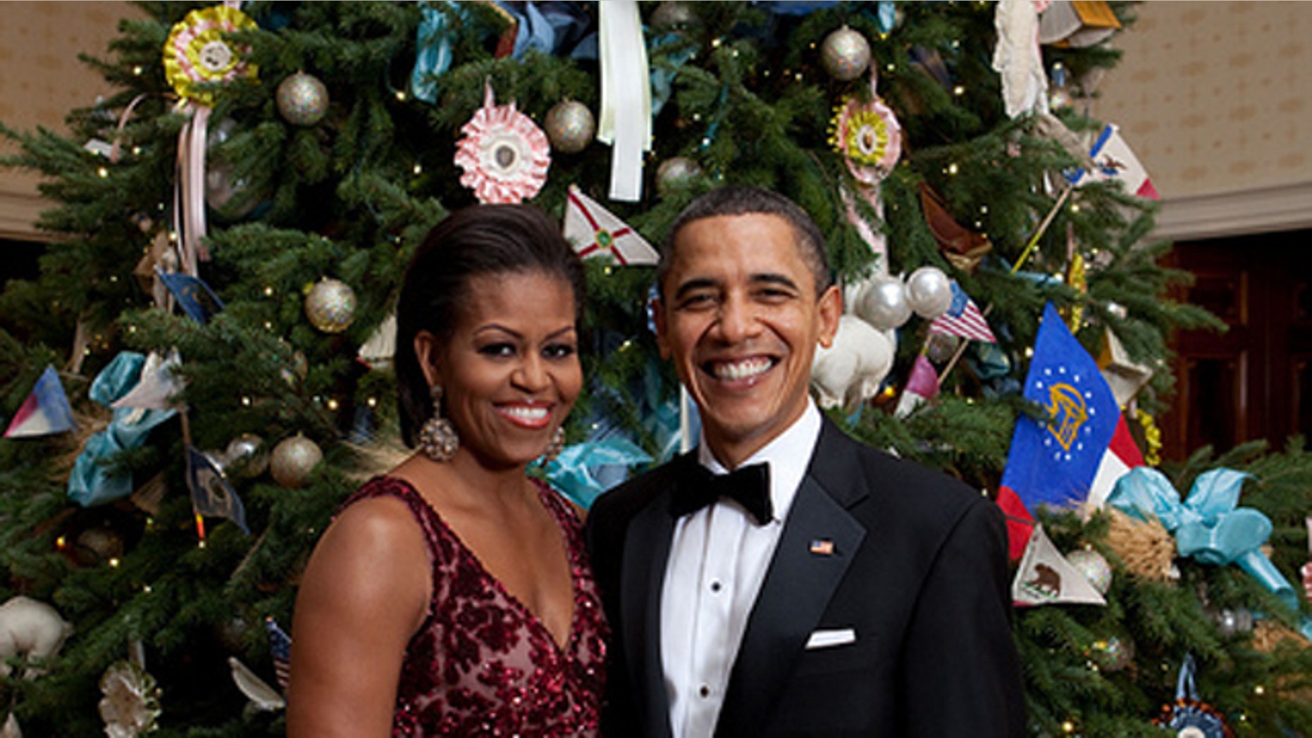 President Barack Obama and First Lady Michelle Obama pose in front of the Official White House Christmas Tree in the Blue Room of the White House, Dec. 5, 2010. (Official White House Photo by Chuck Kennedy)
This official White House photograph is being made available only for publication by news organizations and/or for personal use printing by the subject(s) of the photograph. The photograph may not be manipulated in any way and may not be used in commercial or political materials, advertisements, emails, products, promotions that in any way suggests approval or endorsement of the President, the First Family, or the White House.
