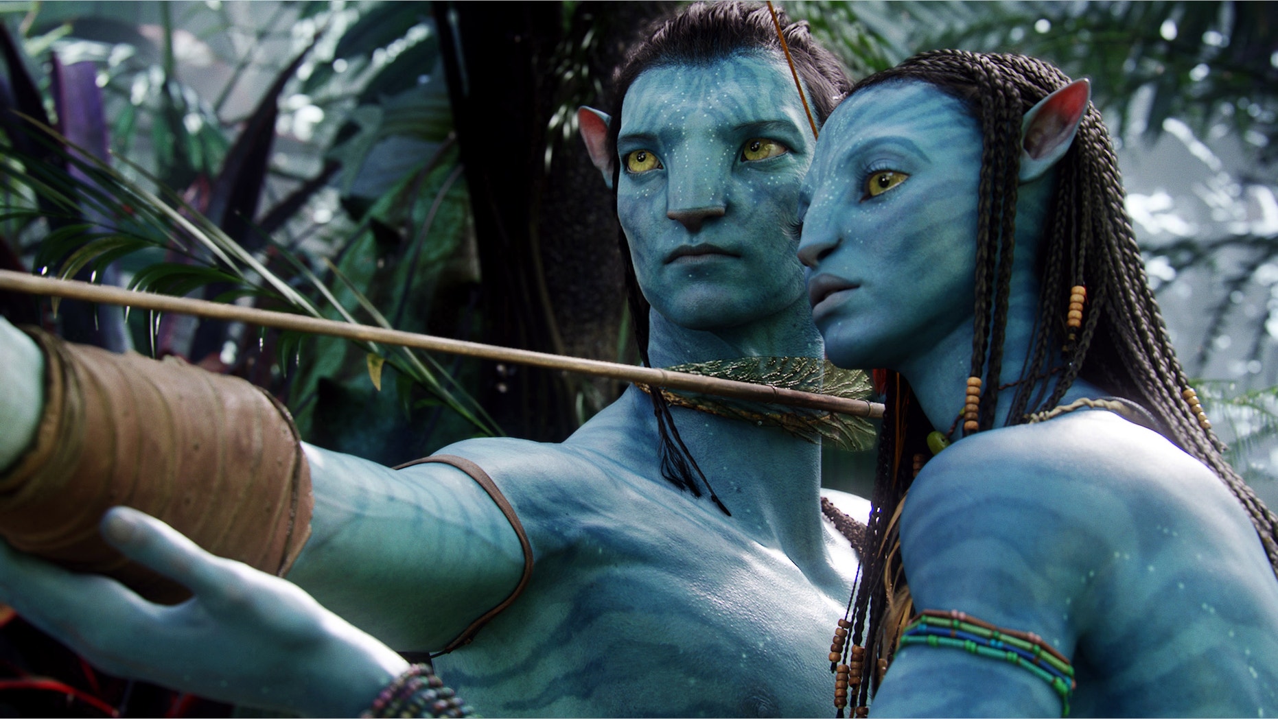 FILE - In this undated file film publicity image originally released by 20th Century Fox, the character Neytiri, voiced by Zoe Saldana, right, and the character Jake, voiced by Sam Worthington are shown in a scene from, "Avatar." Director James Cameron says he plans to make three sequels to his 2009 sci-fi blockbuster movie “Avatar” in New Zealand. (AP Photo/20th Century Fox, File)
