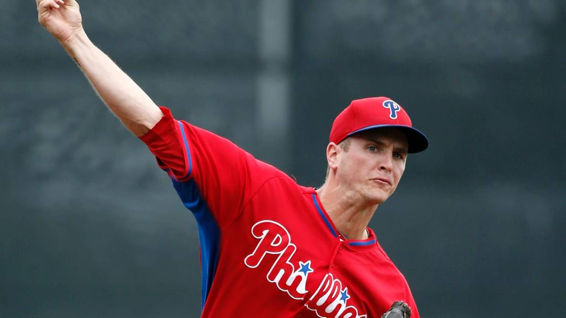 Philadelphia Phillies starting pitcher David Buchanan warms up prior to a spring exhibition baseball game against the Toronto Blue Jays in Dunedin, Fla., Monday, March 24, 2014. (AP Photo/Kathy Willens)