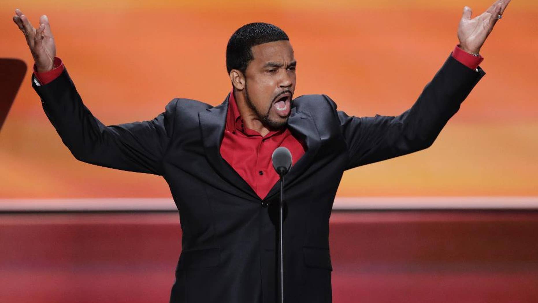 File-This July 20, 2016, file photo shows Darrell Scott, Senior Pastor of New Spirit Revival Center Ministries speaking during the third day of the Republican National Convention in Cleveland. A Cleveland-area minister who told President Donald Trump that Chicago's "top gang thugs" wanted to meet with him to find ways to reduce gun violence said the decision to cancel the event had nothing to do with criticism from activists in the city. The Rev. Scott said the meeting won't happen Tuesday, March 21, 2017, at a hotel near O'Hare International Airport because three people he wanted to attend, including an education expert who became ill at an airport, had to cancel. (AP Photo/J. Scott Applewhite, File)