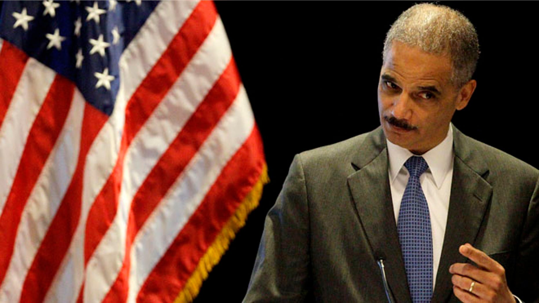 FILE: June 26, 2012: Attorney General Eric Holder gestures while speaking at a civil rights symposium in Boston.