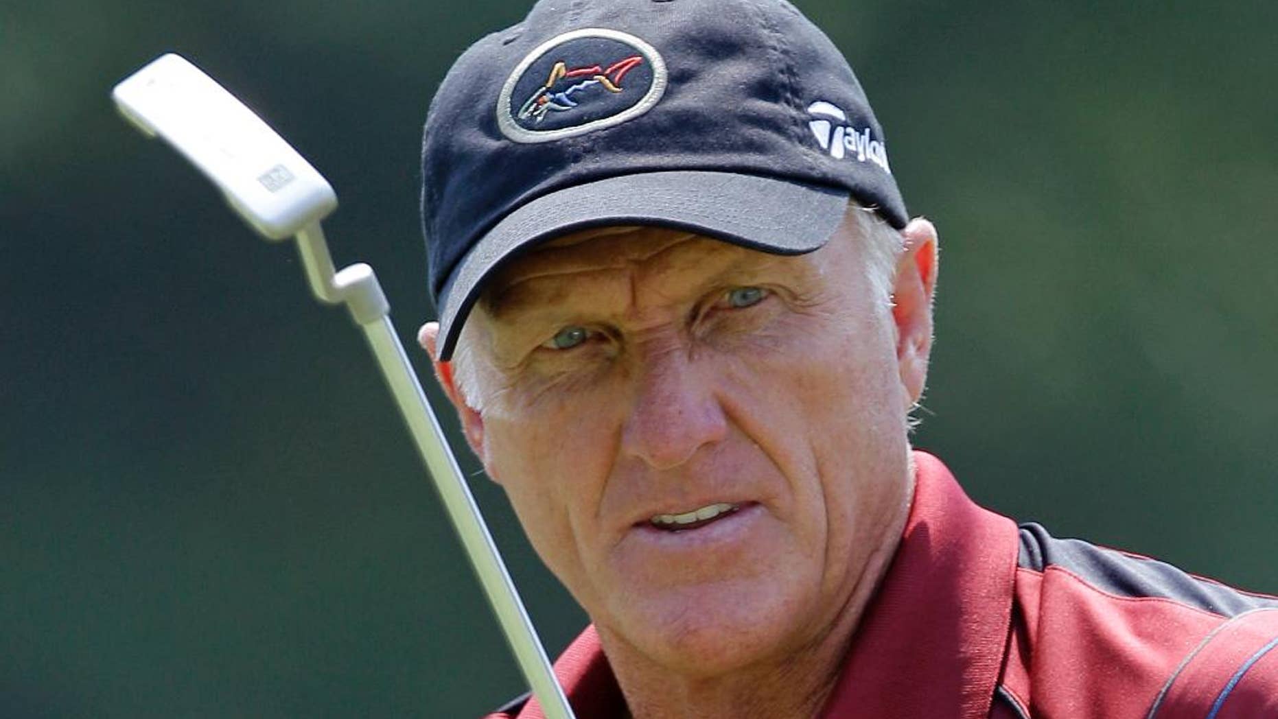 FILE - In this June 28, 2012 file photo, Greg Norman watches his putt on the 16th hole during the first round of the Senior Players Championship golf tournament at the Fox Chapel Country Club in Fox Chapel, Pa. Australia’s Prime Minister Malcolm Turnbull beat other world leaders to an early call with President-elect Donald Trump by getting his cellphone number from Greg Norman, the golfing great said on Thursday, Nov. 17, 2016. (AP Photo/Gene J. Puskar, File)
