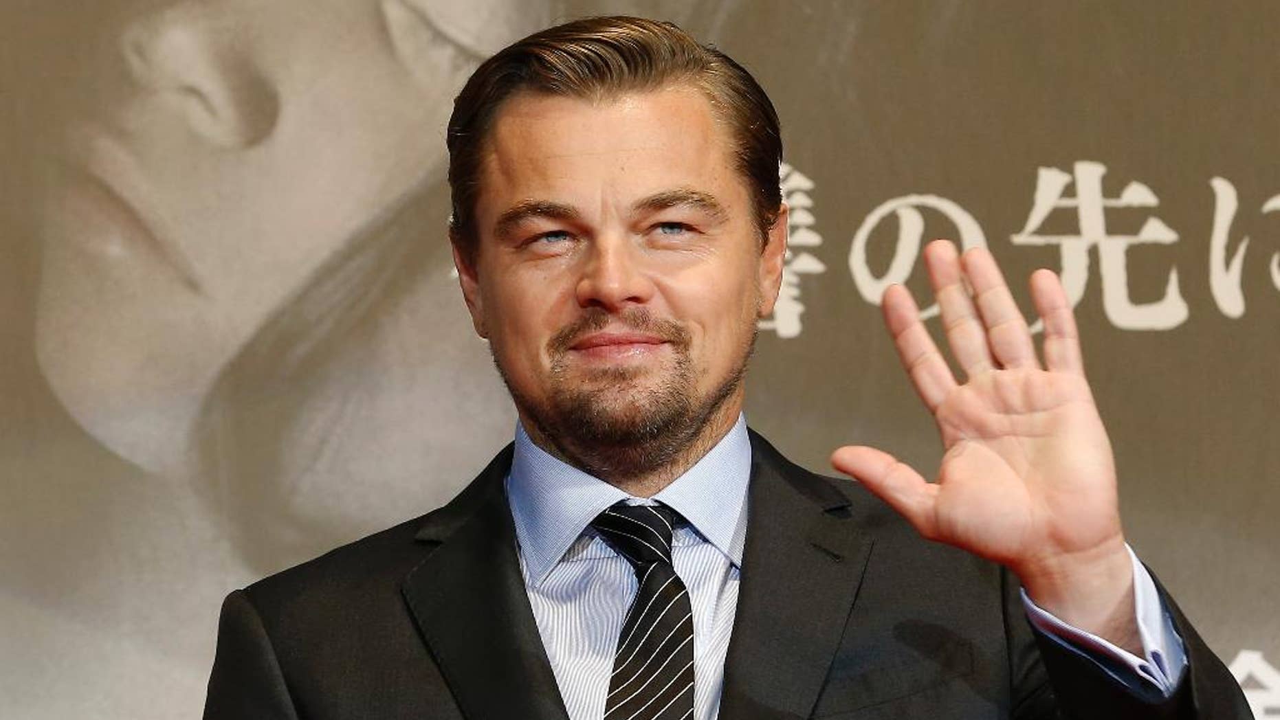 FILE - In this March 23, 2016 file photo, American actor Leonardo DiCaprio waves for fans during the Japan premiere of his new movie "The Revenant" in Tokyo, Japan. Indonesia's environment and forestry minister says Oscar-winning actor DiCaprio lacked complete information when he criticized the destruction of rainforests during a visit to a protected national park in March. His comments prompted immigration officials to warn that DiCaprio could be barred from reentering Indonesia, but the minister, Siti Nurbaya, said she appreciates his good intentions and hopes to cooperate with him in future. (AP Photo/Shizuo Kambayashi, File)