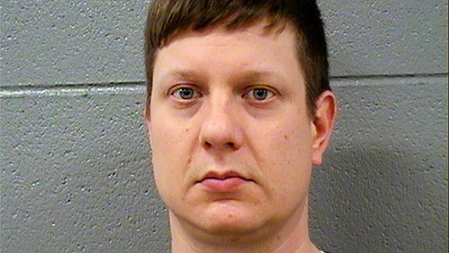 FILE - This Nov. 24, 2015 file photo released by the Cook County Sheriff's Office shows Chicago police Officer Jason Van Dyke, who was charged with first degree murder after a squad car video caught him fatally shooting 17-year-old Laquan McDonald 16 times. Van Dyke is scheduled to return to court Monday, Nov. 30, 2015, to learn whether he'll be offered bond. (Cook County Sheriff's Office via AP)