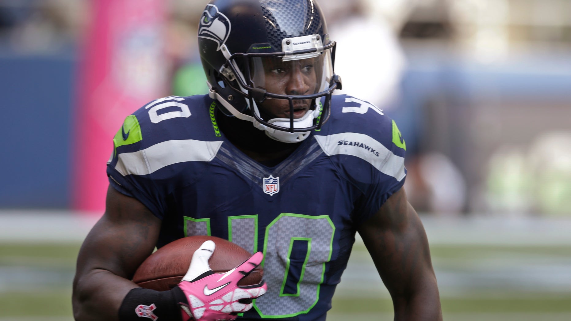 In this Oct. 13, 2013, photo, Seattle Seahawks' Derrick Coleman carries the ball against the Tennessee Titans during an NFL football game in Seattle. Coleman never listened to all those people telling him what he couldn't do. He couldn't hear them, anyway, on his way to becoming first deaf offensive player in the NFL. (AP Photo/Elaine Thompson)