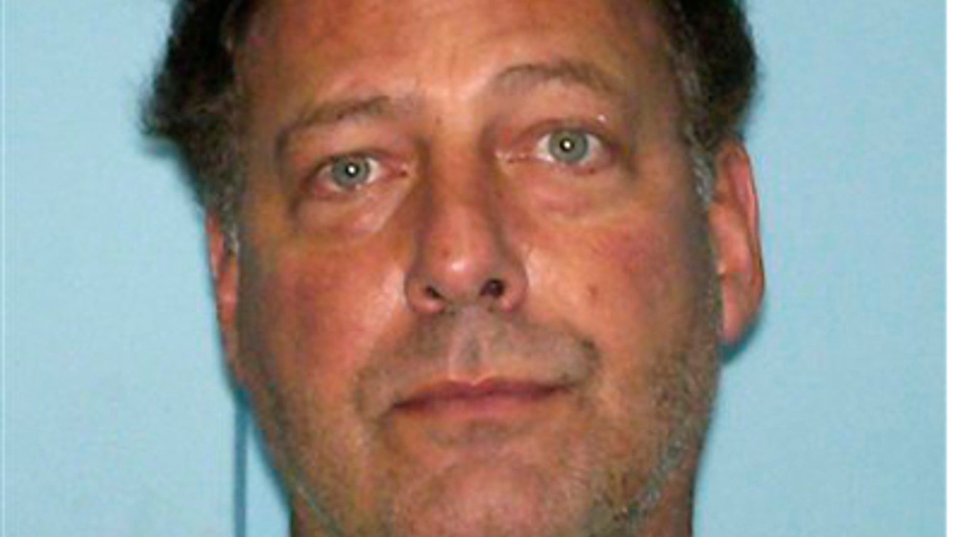 In this picture released Thursday Aug. 11, 2011, U.S. citizen Gary V. Giordano, 50, of Gaithersburg, Maryland is shown on an Aruba's police mugshot in Oranjestad, Aruba.