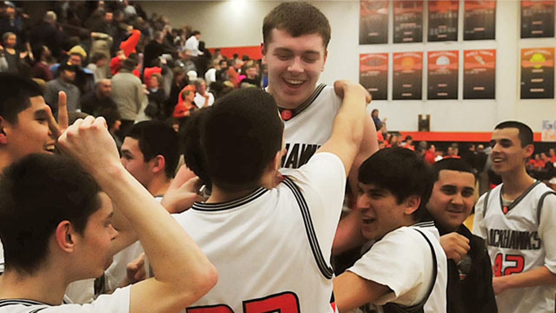 March 3, 2011: Members of the Fennville High School basketball team lift Wes Leonard, top, after he made a game-winning layup in overtime against Bridgman, in Fennville, Mich.