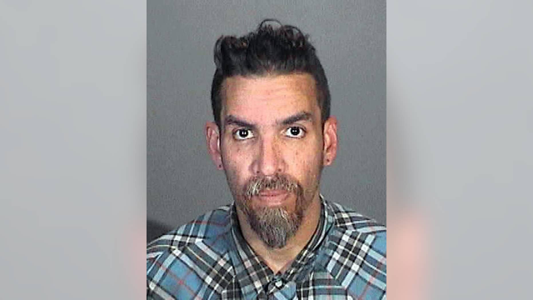 This March 12, 2015 booking photo provided by the Glendale, Calif., Police Department shows Derick Ion Almena. Almena is an operator of the Ghost Ship warehouse in Oakland, in which dozens of people died in a fire that started Dec. 2, 2016. Spokeswoman Tawnee Lightfoot says Almena was stopped for driving with expired registration and, after a consensual search, two license plates from Oakland-area stolen cars were found. The charges apparently were not pursued. (Glendale Police Department via AP)